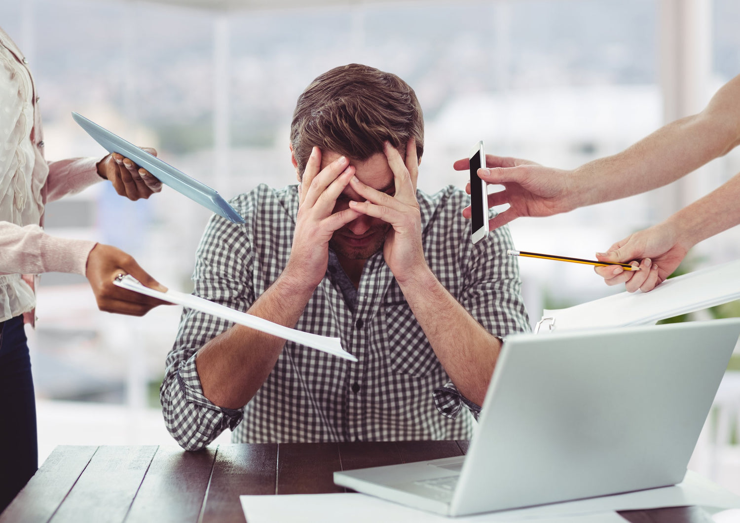 Stressed out man with lots of priorities